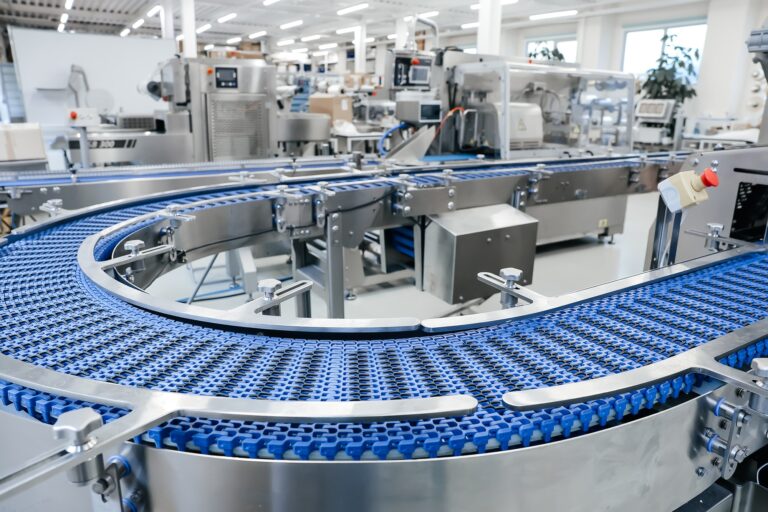Empty modern conveyor belt of production line, part of industrial equipment in factory plant